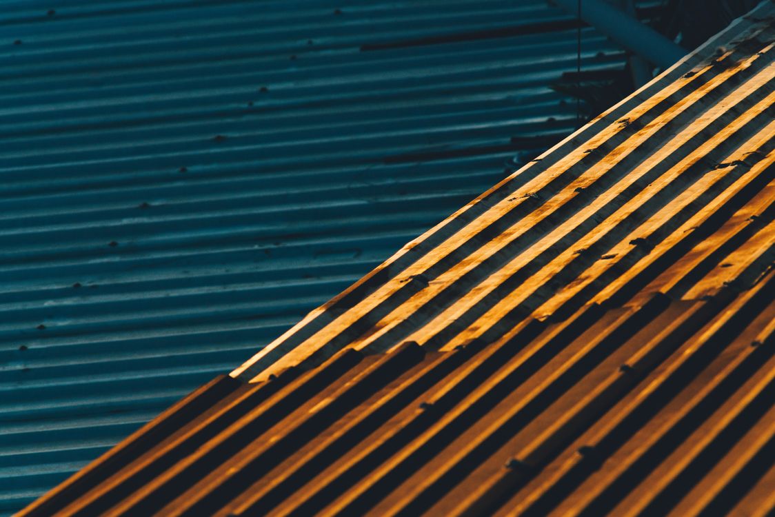 Corrugated metal roof sheets in sunlight
