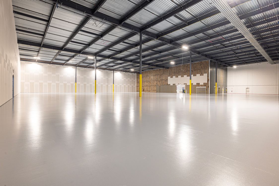 Modern warehouse interior with steel roof structure